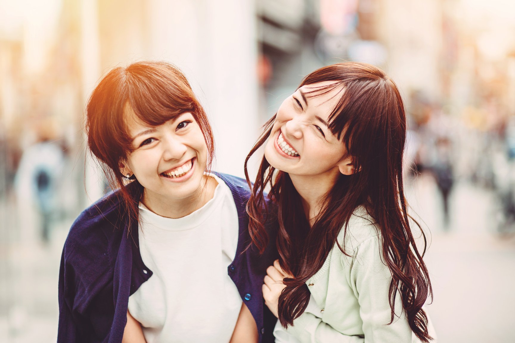 Happy japanese girl friends outdoors in Japan